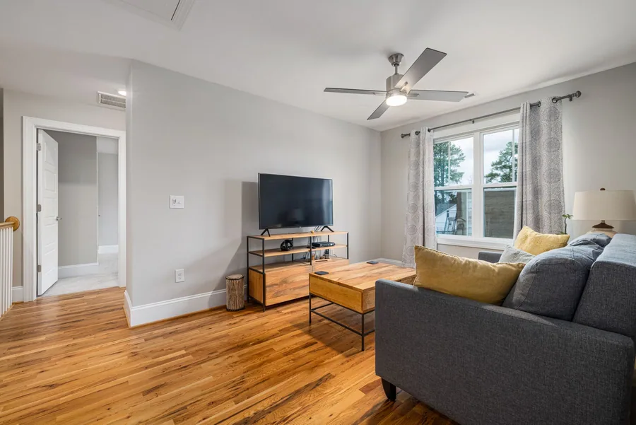 Bright living room with wood-toned flooring, shown as interior inspiration.